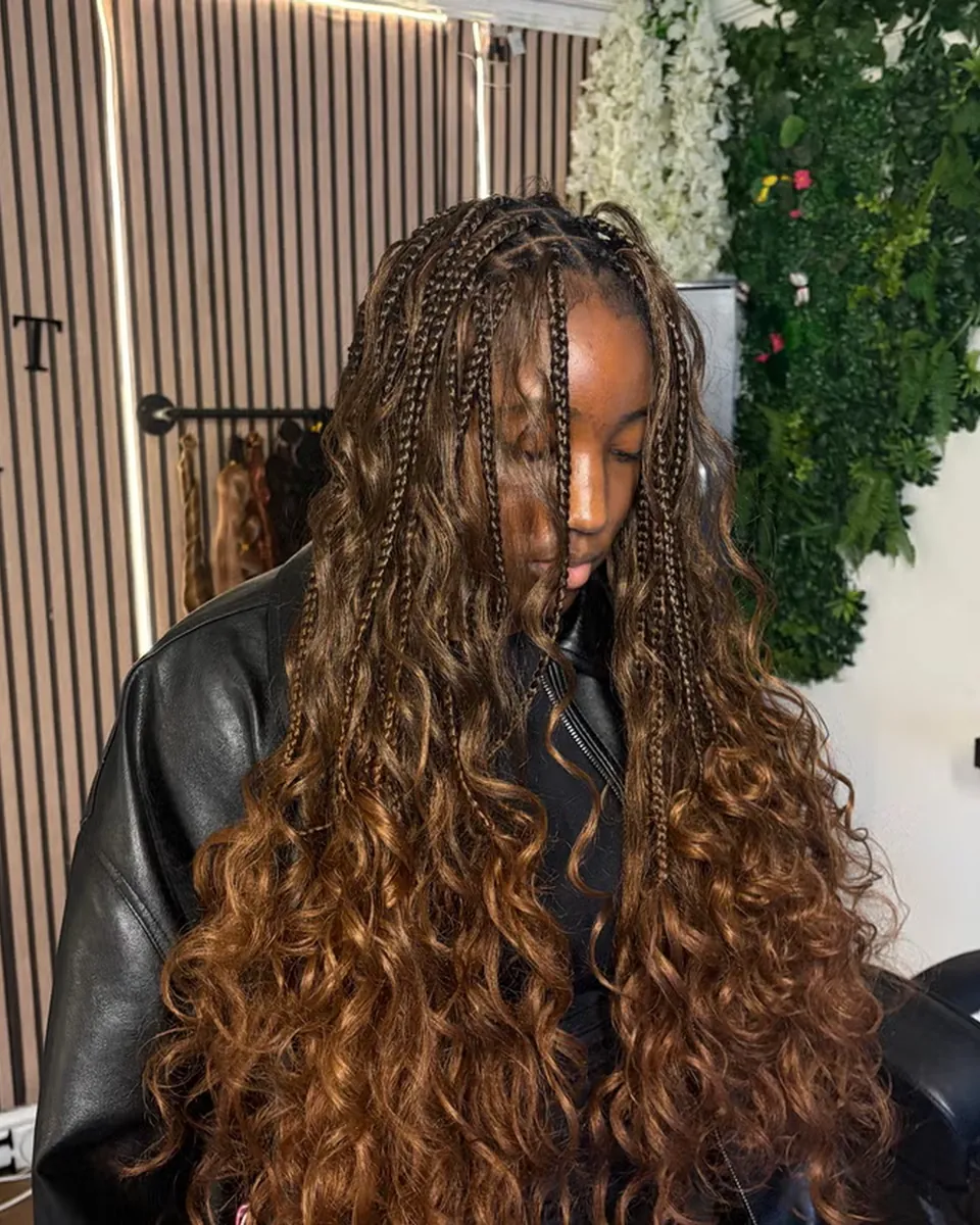 Long boho knotless braids with curled ends, finished at the studio