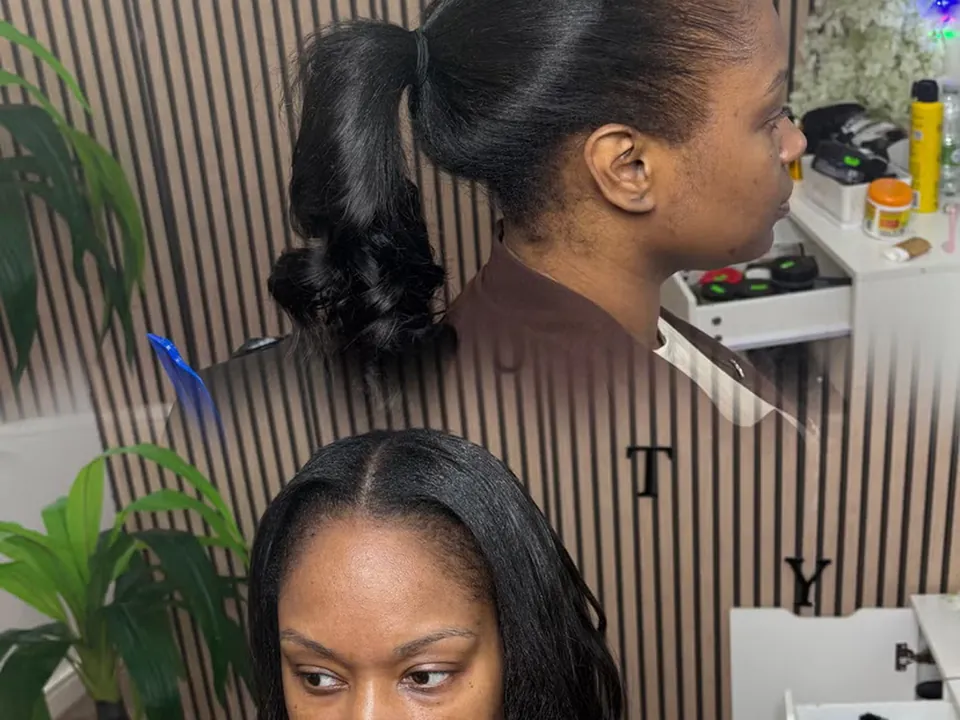 Hair styled into a smooth, high sleek ponytail